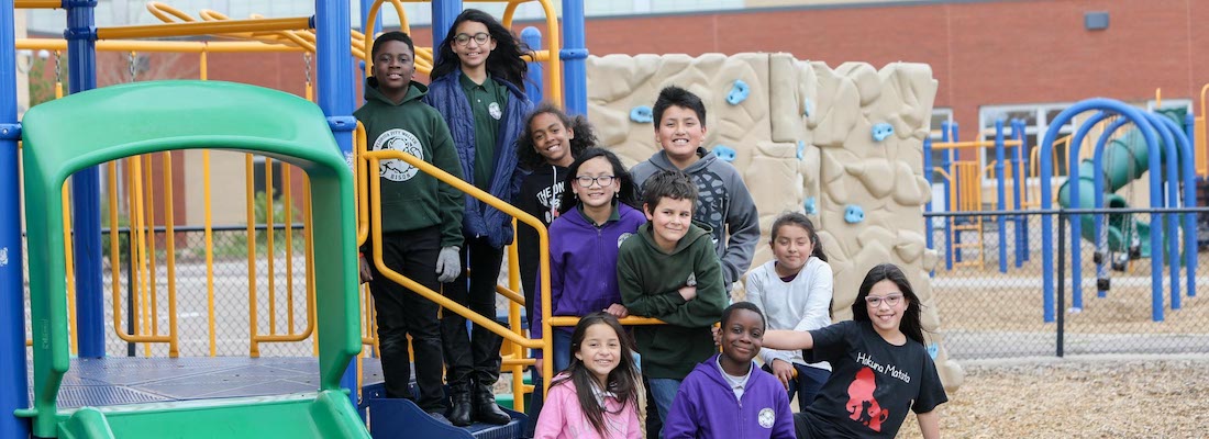 Group of students posing on the playground